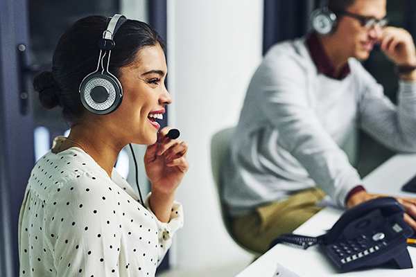 Women helping a client book an appointment at call center